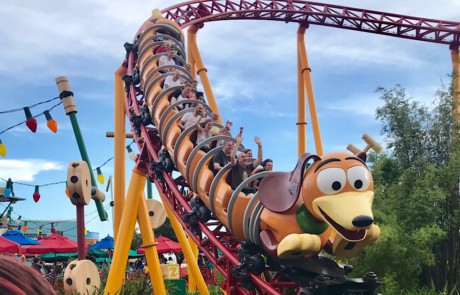 Roller coaster swooping down through Disney World's Toy Story Land.